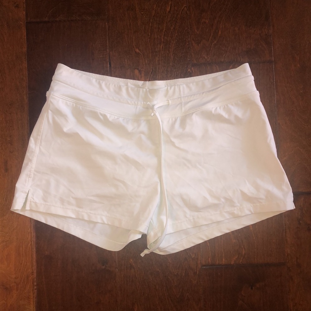 White Athleta shorts, bathing suit type material